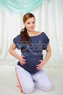 Portrait of a young pregnant girl