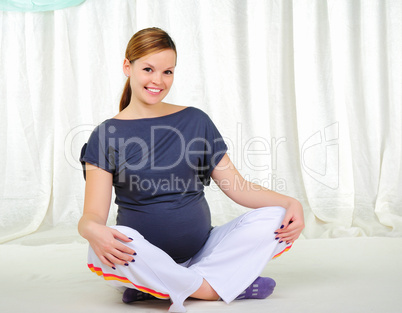 Portrait of a young pregnant girl