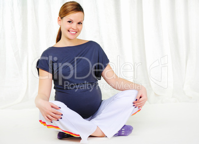 Portrait of a young pregnant girl