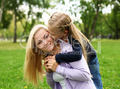 Mother and daughter in park