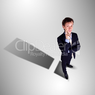 Businessman with shadow as a currency symbol