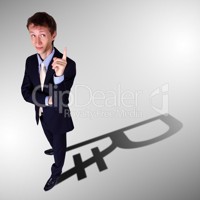 Businessman with shadow as a currency symbol