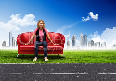 Young woman sitting on sofa nature background