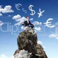 Businessman on the top of a high mountain