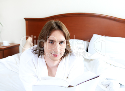 portrait of a young man in bed