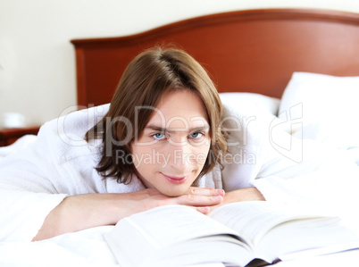 portrait of a young man in bed