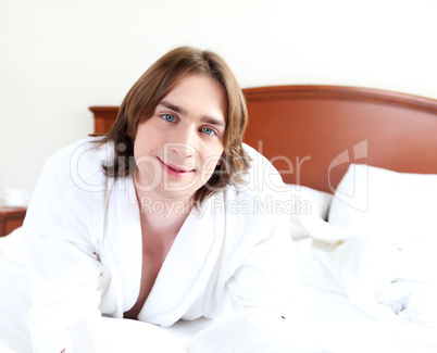 portrait of a young man in bed