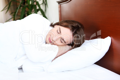 portrait of a young man in bed