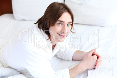 portrait of a young man in bed