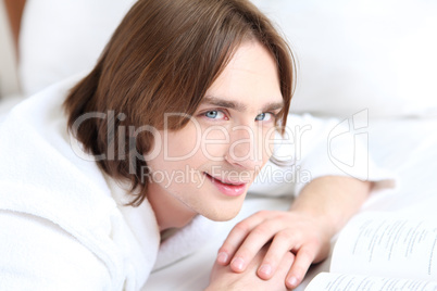 portrait of a young man in bed