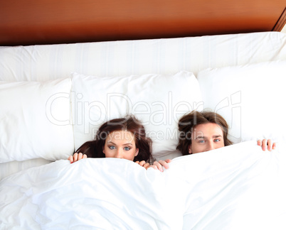 portrait of  young couple in bed