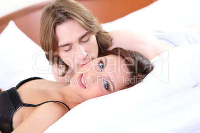 portrait of  young couple in bed