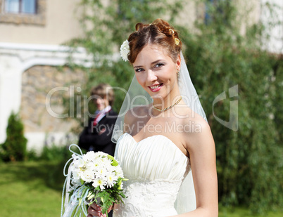 Portrait of a young bride in a white dress