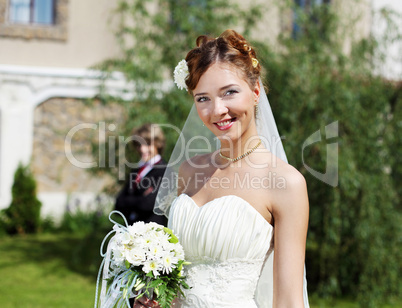 Portrait of a young bride in a white dress