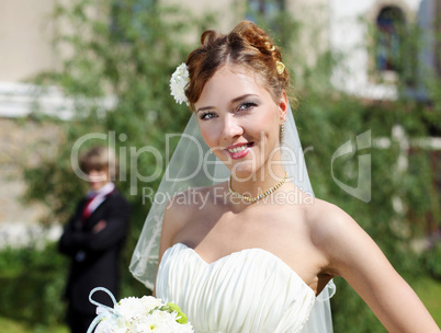 Portrait of a young bride in a white dress