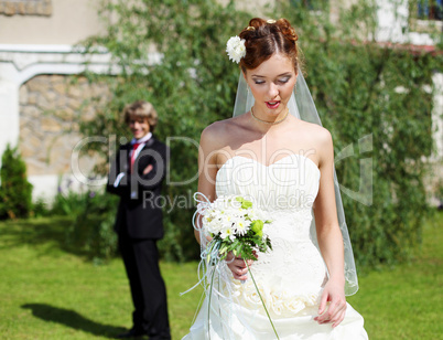 Portrait of a young bride in a white dress