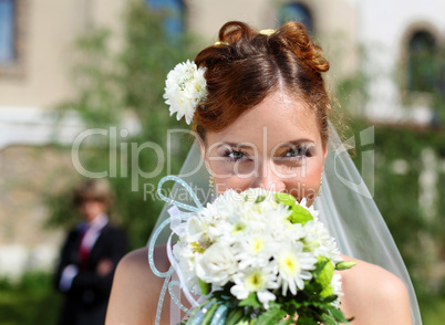 Portrait of a young bride in a white dress