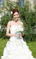 Portrait of a young bride in a white dress