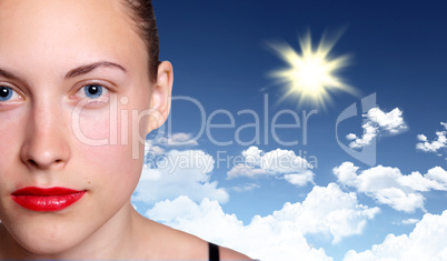 Woman against blue sky background