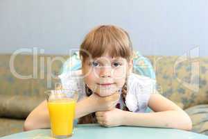 portrait of little girl with orange juice