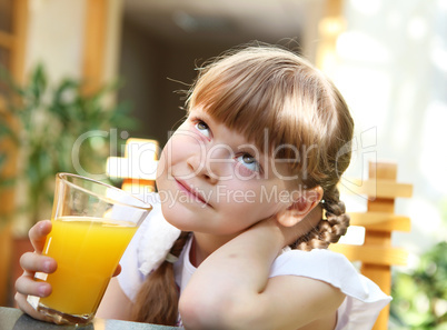 portrait of little girl with orange juice