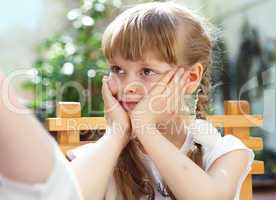 portrait of little girl outdoors