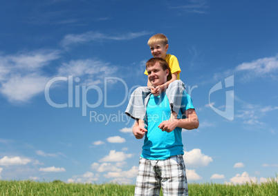 father with son in summer day outdoors