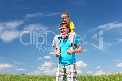 father with son in summer day outdoors