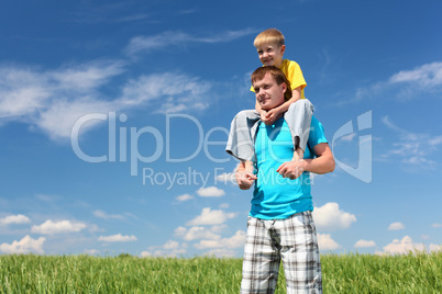 father with son in summer day outdoors