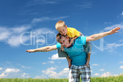 father with son in summer day outdoors