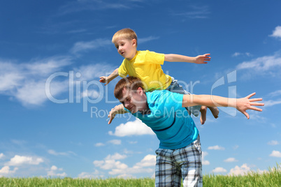 father with son in summer day outdoors