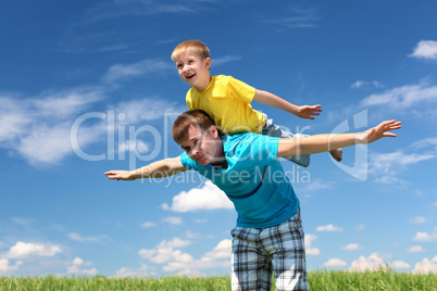 father with son in summer day outdoors