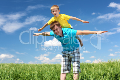 father with son in summer day outdoors