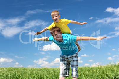 father with son in summer day outdoors