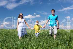 family with son on the meadow