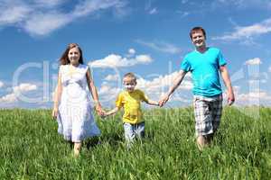 family with son on the meadow