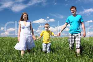 family with son on the meadow