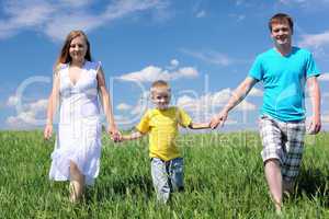 family with son on the meadow