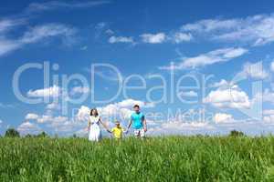 family with son on the meadow