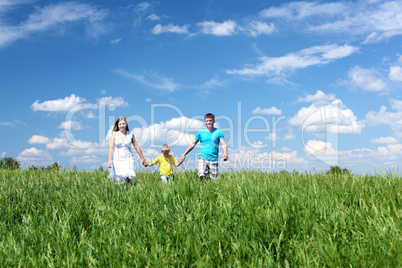 family with son on the meadow