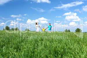 family with son on the meadow