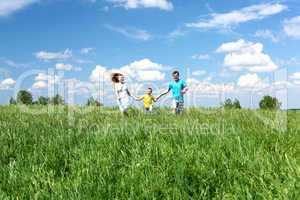 family with son on the meadow