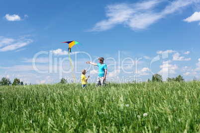 father with son in summer with kite