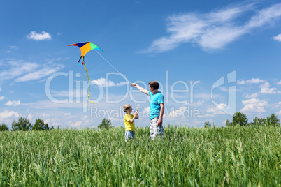 father with son in summer with kite