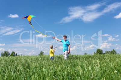 father with son in summer with kite