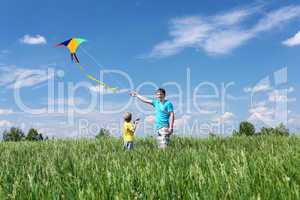 father with son in summer with kite