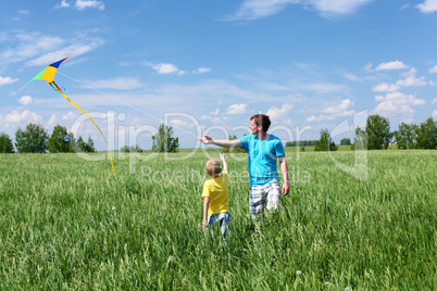 father with son in summer with kite