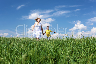 mother with son on the meadow