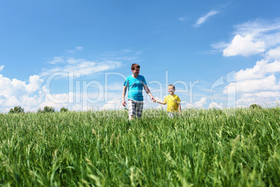 father with son in summer day outdoors