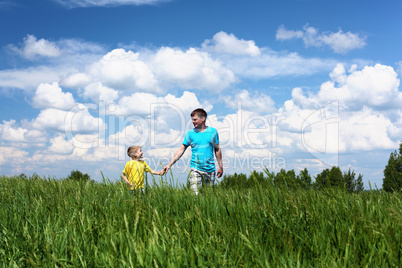 father with son in summer day outdoors